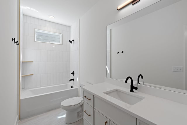 full bath featuring toilet, vanity, and shower / bath combination