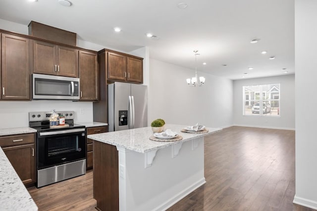 5210 Gladecress Ln, Hermitage, TN 37076 - kitchen with stainless steel appliances, a center island, dark wood-style floors, dark brown cabinetry, and recessed lighting