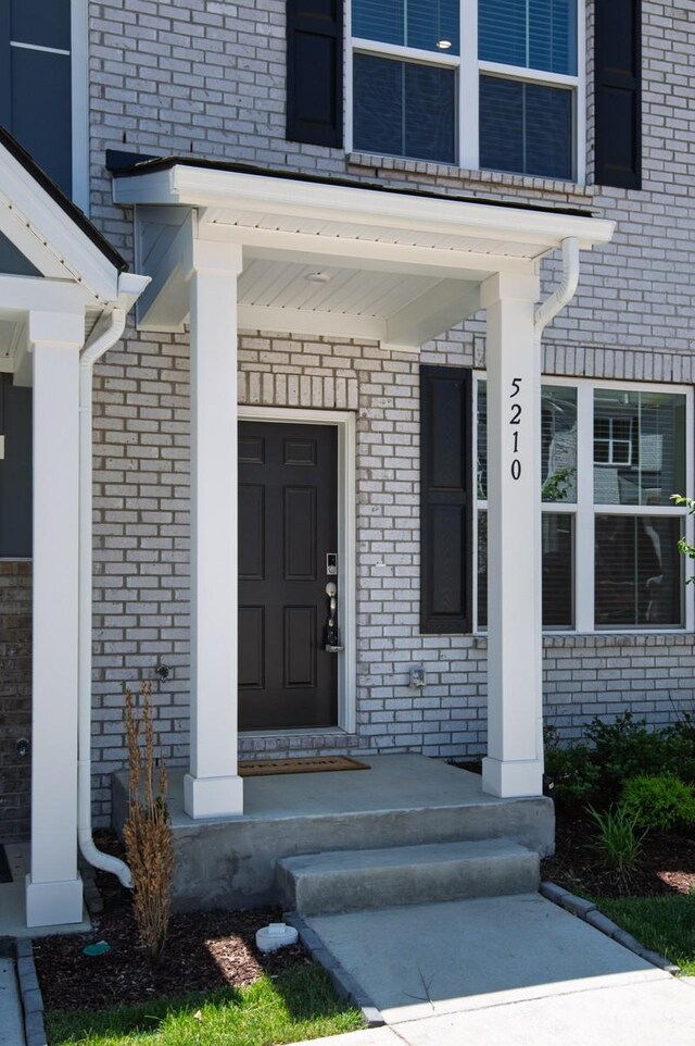 5210 Gladecress Ln, Hermitage, TN 37076 - property entrance featuring brick siding and a porch