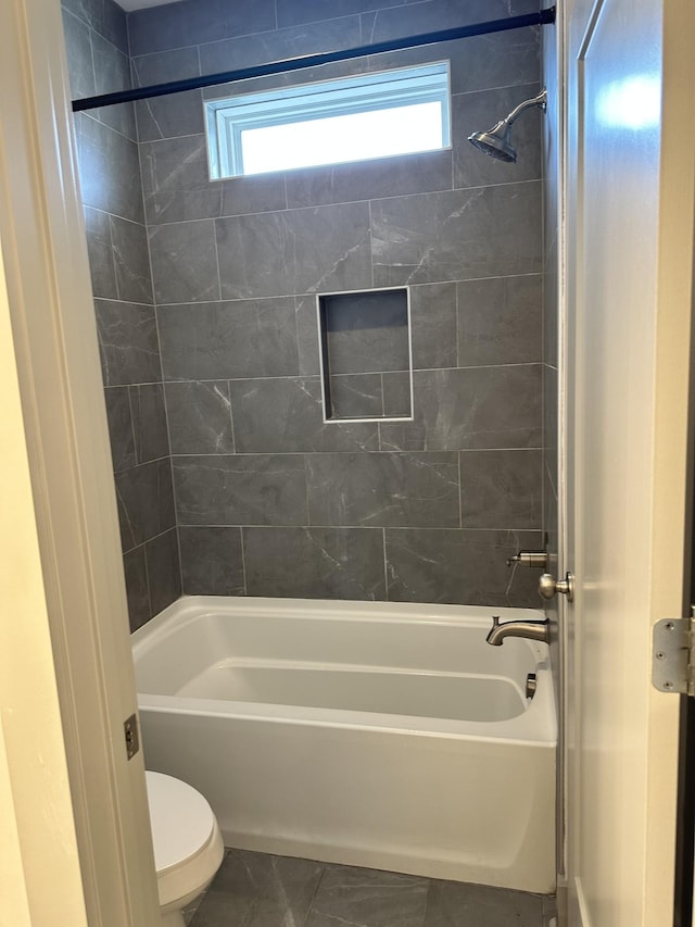 full bathroom with toilet, shower / bathtub combination, and tile patterned floors