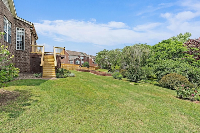 view of yard featuring stairway and a wooden deck