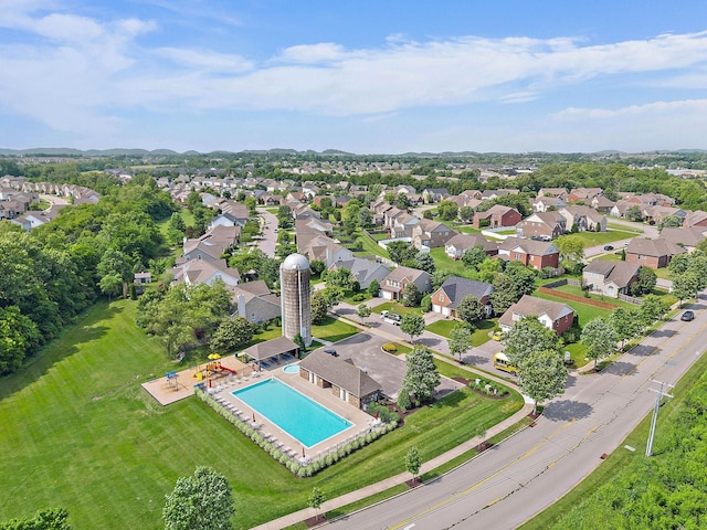 aerial view of residential area with a pool