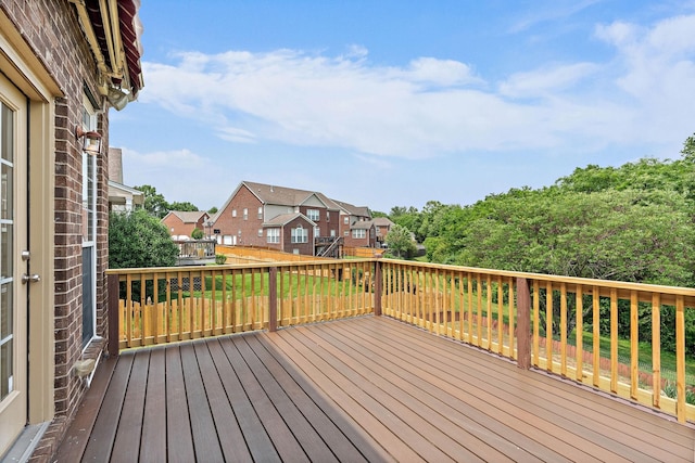 wooden deck with a residential view