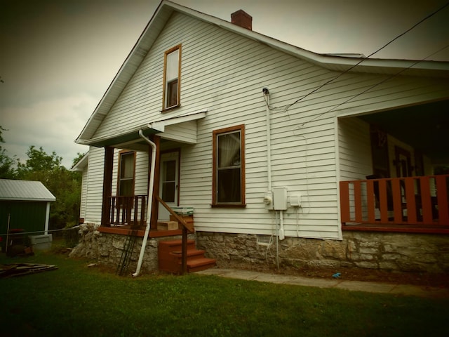 165 E Main St, Alexandria, TN 37012 - rear view of property featuring a chimney and a yard