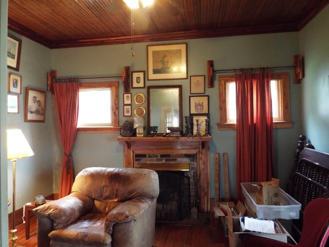 165 E Main St, Alexandria, TN 37012 - living area with ornamental molding, wood finished floors, ceiling fan, wooden ceiling, and a fireplace