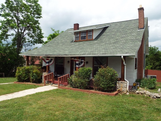165 E Main St, Alexandria, TN 37012 - view of front of property with a chimney, covered porch, a front yard, and central air condition unit