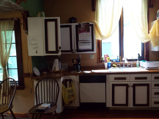 165 E Main St, Alexandria, TN 37012 - kitchen with dishwasher, a sink, and white cabinetry