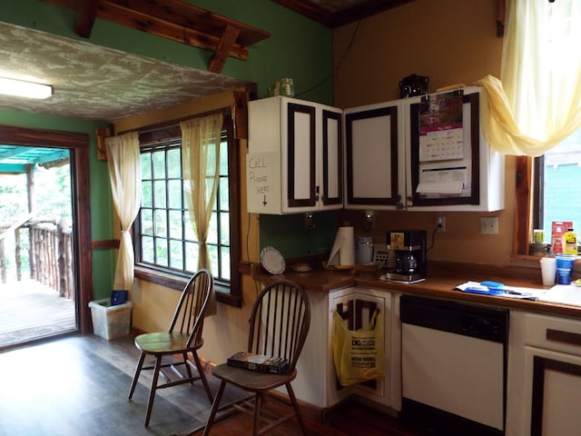 165 E Main St, Alexandria, TN 37012 - kitchen featuring dishwasher, wood finished floors, and white cabinets