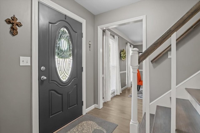 1209 Corlew Dr, Burns, TN 37029 - entrance foyer with wood finished floors, stairs, ornamental molding, and baseboards