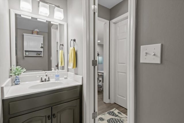 1209 Corlew Dr, Burns, TN 37029 - bathroom featuring wood finished floors and vanity