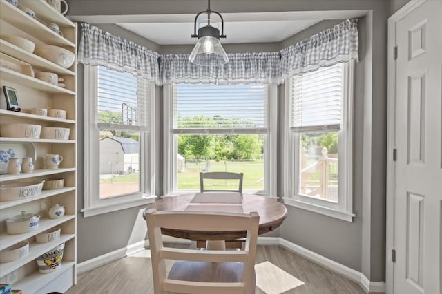 1209 Corlew Dr, Burns, TN 37029 - dining area featuring baseboards, healthy amount of natural light, and wood finished floors