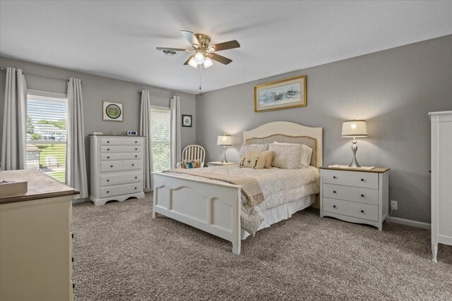 1209 Corlew Dr, Burns, TN 37029 - carpeted bedroom featuring baseboards and ceiling fan