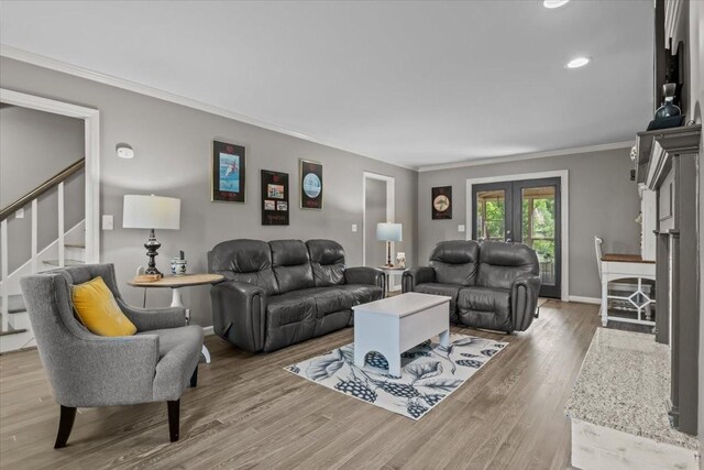 1209 Corlew Dr, Burns, TN 37029 - living room featuring ornamental molding, stairs, wood finished floors, baseboards, and recessed lighting