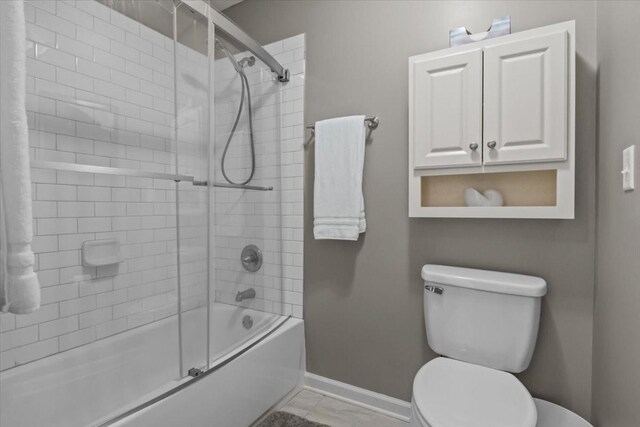 1209 Corlew Dr, Burns, TN 37029 - full bath featuring baseboards, toilet, and shower / bath combination with glass door