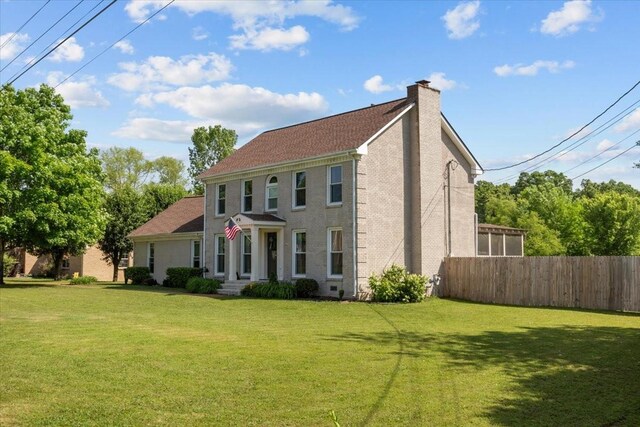 1209 Corlew Dr, Burns, TN 37029 - view of front of property with a chimney and brick siding