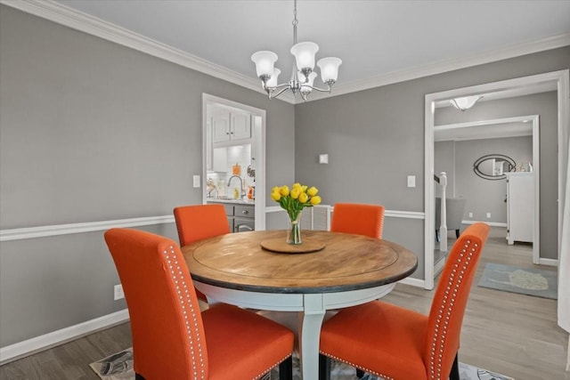 1209 Corlew Dr, Burns, TN 37029 - dining room featuring a chandelier, wood finished floors, crown molding, and baseboards
