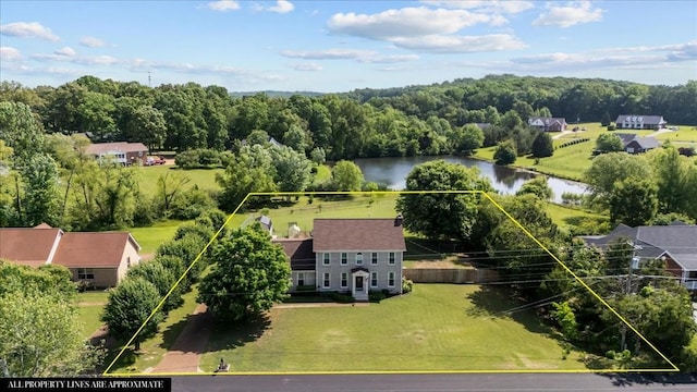 1209 Corlew Dr, Burns, TN 37029 - aerial view of property and surrounding area with a large body of water and property boundaries highlighted
