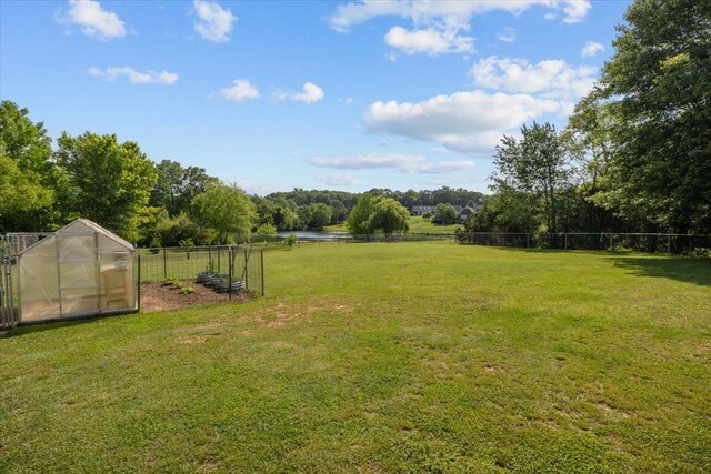 1209 Corlew Dr, Burns, TN 37029 - view of yard with a greenhouse and an outbuilding