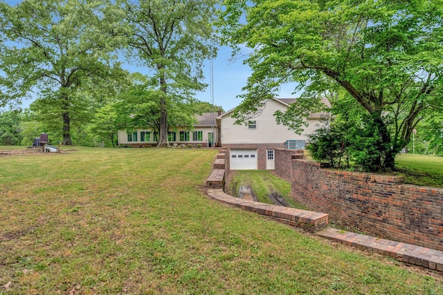 735 Railroad Bed Pike, Summertown, TN 38483 - view of grassy yard with an attached garage