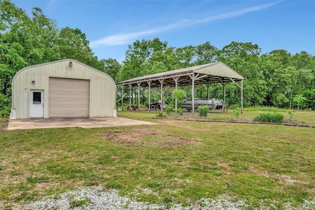 735 Railroad Bed Pike, Summertown, TN 38483 - view of green lawn with an outdoor structure and a detached garage