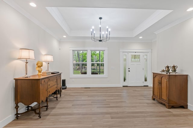 120 Destineys Way, Gruetli Laager, TN 37339 - foyer with ornamental molding, a raised ceiling, light wood finished floors, a chandelier, and baseboards