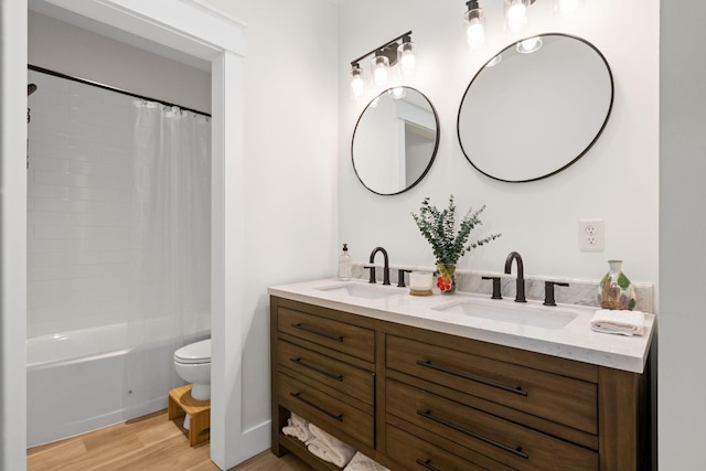 120 Destineys Way, Gruetli Laager, TN 37339 - bathroom featuring wood finished floors, toilet, double vanity, and shower / bath combo with shower curtain