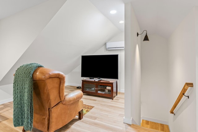 120 Destineys Way, Gruetli Laager, TN 37339 - living area with lofted ceiling, a wall mounted air conditioner, baseboards, light wood-type flooring, and an upstairs landing