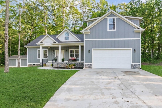 120 Destineys Way, Gruetli Laager, TN 37339 - craftsman-style house with covered porch, a front yard, concrete driveway, and stone siding