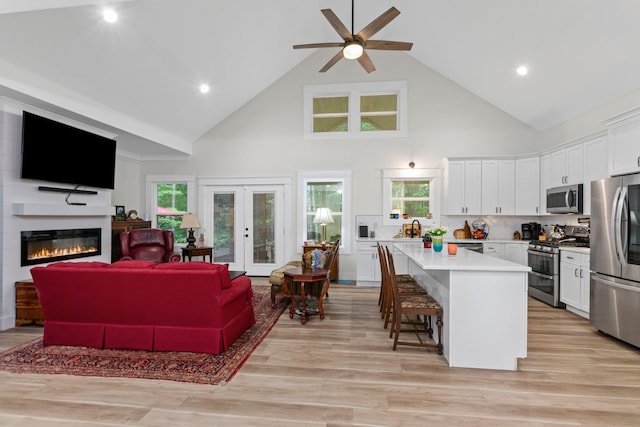 120 Destineys Way, Gruetli Laager, TN 37339 - kitchen with appliances with stainless steel finishes, high vaulted ceiling, white cabinetry, open floor plan, and ceiling fan