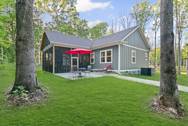 120 Destineys Way, Gruetli Laager, TN 37339 - back of house featuring board and batten siding, a sunroom, a patio area, and a yard