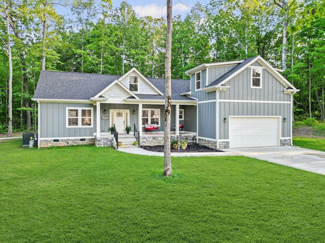 120 Destineys Way, Gruetli Laager, TN 37339 - view of front of home with board and batten siding, roof with shingles, covered porch, and a garage