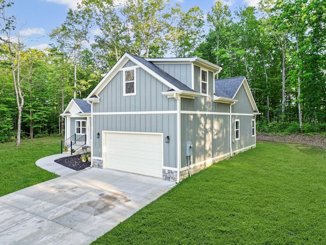 120 Destineys Way, Gruetli Laager, TN 37339 - view of front of house featuring concrete driveway, a garage, a front yard, roof with shingles, and board and batten siding
