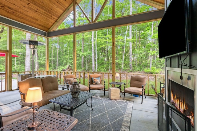 120 Destineys Way, Gruetli Laager, TN 37339 - sunroom / solarium with lofted ceiling, an outdoor living space with a fireplace, and plenty of natural light