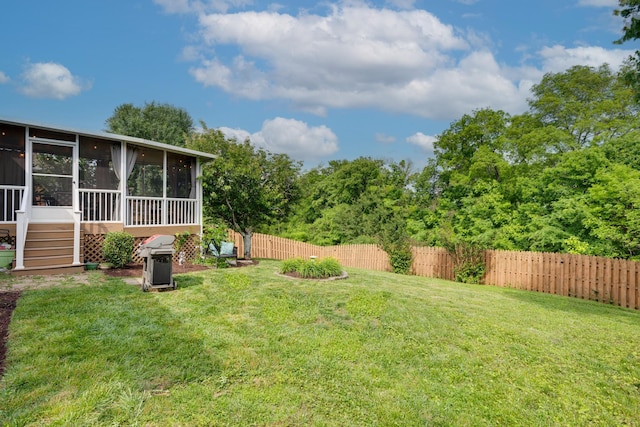 view of yard with a sunroom
