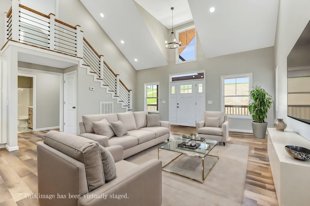 2582 Gap Rd, Altamont, TN 37301 - living area featuring a towering ceiling, wood finished floors, baseboards, stairs, and recessed lighting