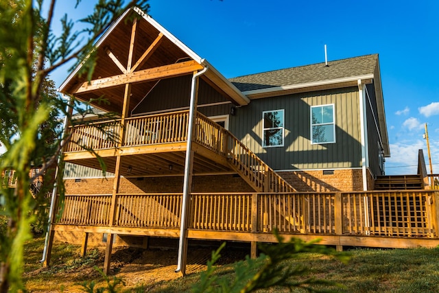 2582 Gap Rd, Altamont, TN 37301 - rear view of house with roof with shingles, stairs, a deck, board and batten siding, and crawl space