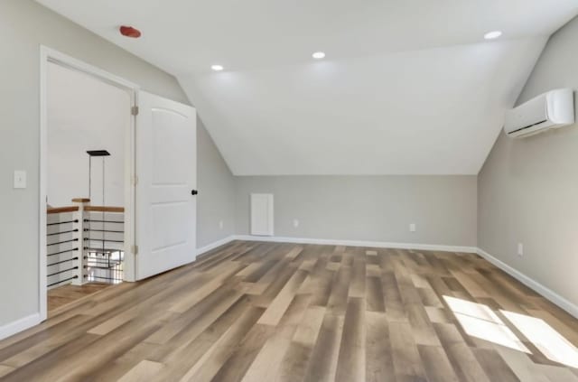 2582 Gap Rd, Altamont, TN 37301 - bonus room with an AC wall unit, lofted ceiling, wood finished floors, baseboards, and recessed lighting