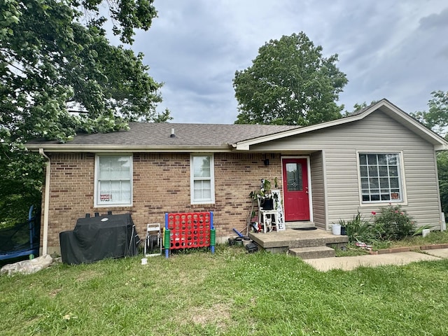 407 Marshall Stuart Dr, Dickson, TN 37055 - view of front of house featuring a front lawn, brick siding, and a shingled roof