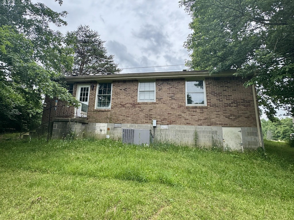 407 Marshall Stuart Dr, Dickson, TN 37055 - view of side of property featuring brick siding and central air condition unit