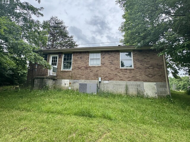 407 Marshall Stuart Dr, Dickson, TN 37055 - view of side of property featuring brick siding and central air condition unit