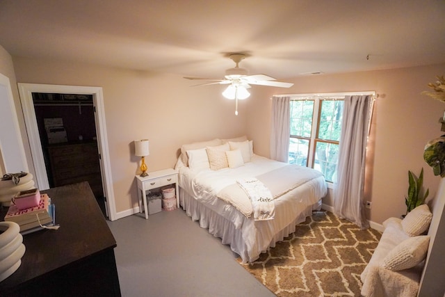 bedroom featuring baseboards and a ceiling fan