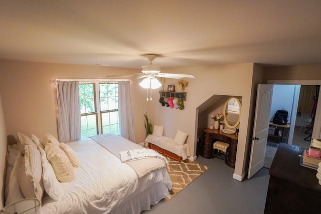 bedroom with a ceiling fan and a fireplace