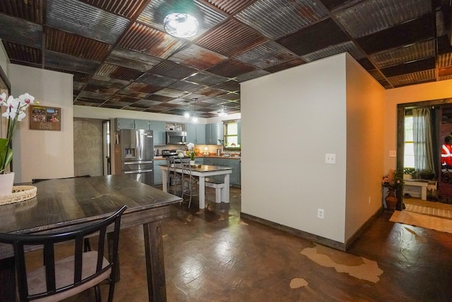 kitchen featuring appliances with stainless steel finishes and baseboards