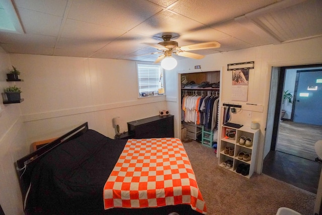 carpeted bedroom with a closet and ceiling fan