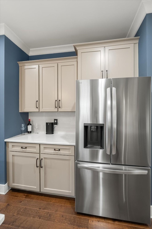 429 Finnhorse Ln, Franklin, TN 37064 - kitchen featuring stainless steel fridge with ice dispenser, crown molding, light countertops, dark wood-style floors, and tasteful backsplash