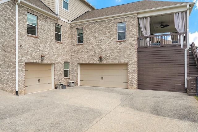 429 Finnhorse Ln, Franklin, TN 37064 - rear view of property featuring a garage, concrete driveway, and brick siding