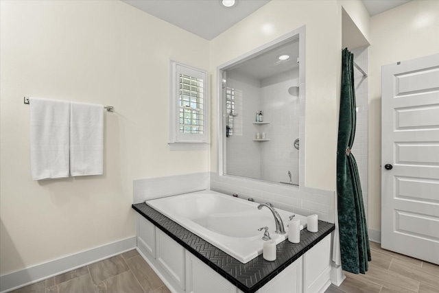 429 Finnhorse Ln, Franklin, TN 37064 - full bathroom with baseboards, a tile shower, and a garden tub