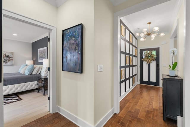 429 Finnhorse Ln, Franklin, TN 37064 - foyer entrance with a chandelier, dark wood-style flooring, baseboards, and ornamental molding