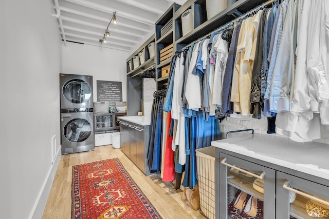 55 E Main St # 208, Chattanooga, TN 37408 - laundry room with stacked washing machine and dryer and light wood finished floors