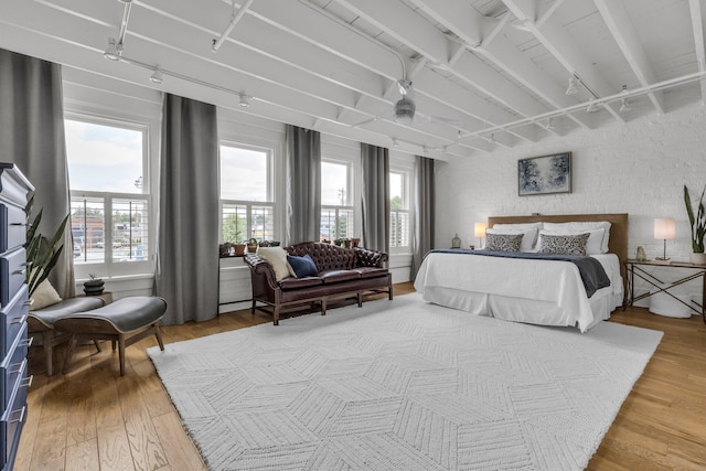 55 E Main St # 208, Chattanooga, TN 37408 - bedroom with light wood-style floors and beamed ceiling